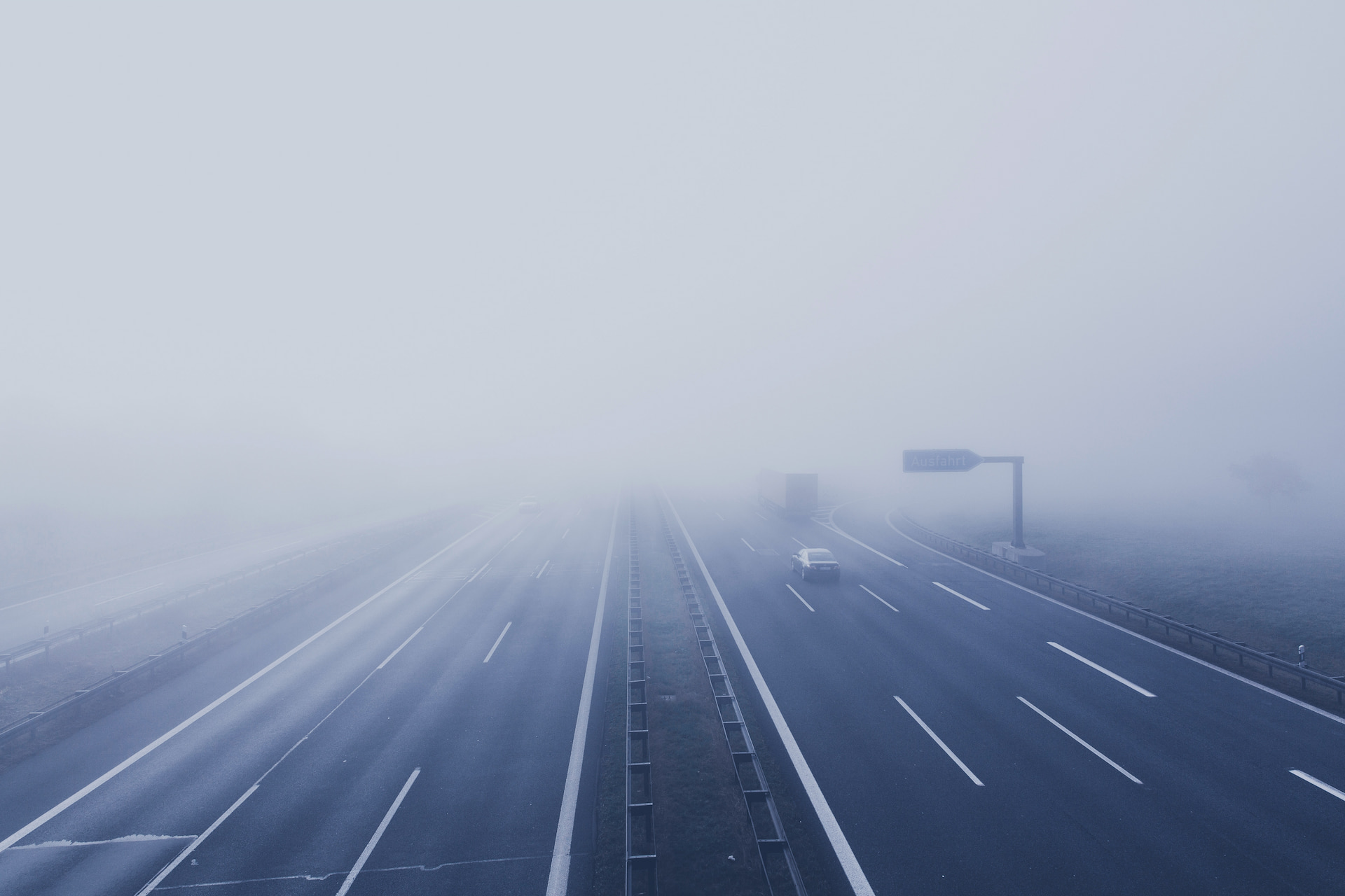Vehicles driving on a foggy highway