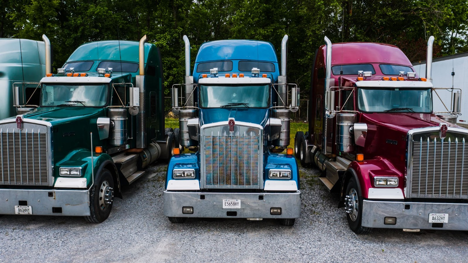 Big rig semi truck arsenal of red, blue, and green trucks