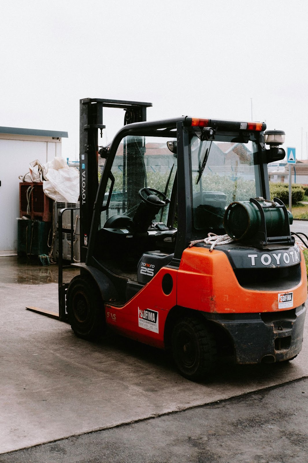 An orange class-I forklift located outside