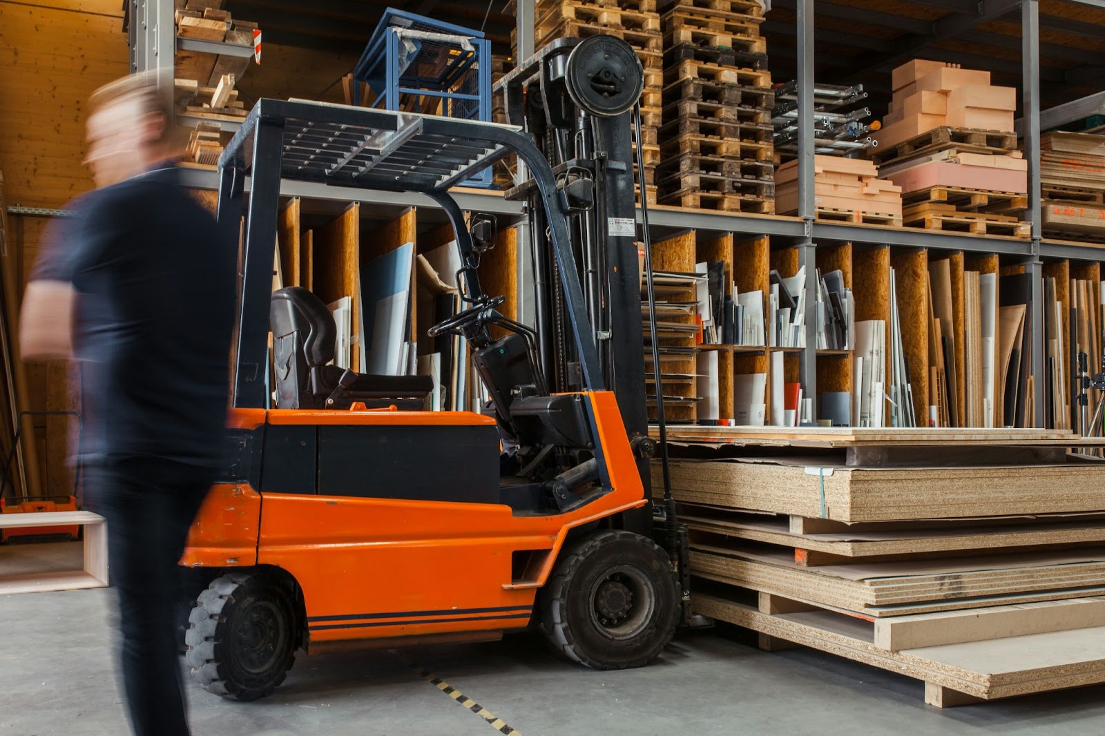 A class-III electric motor forklift lifting wood sheets