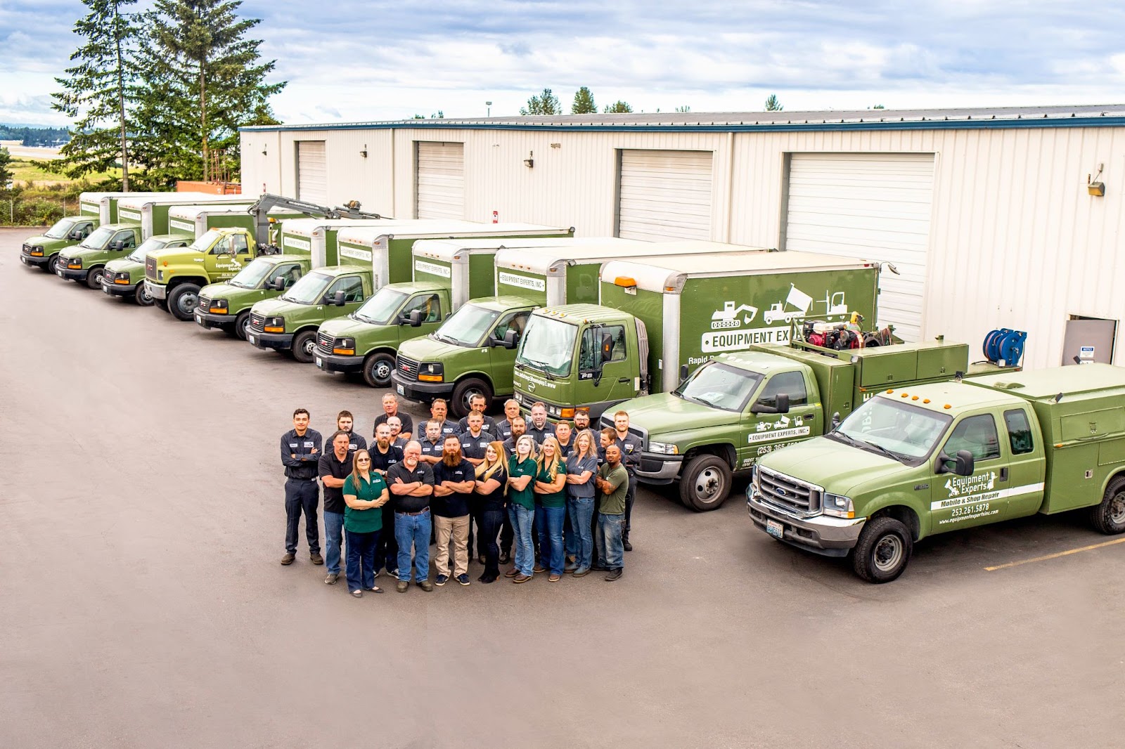 An aerial-style picture of the Equipment Experts team with their trucks