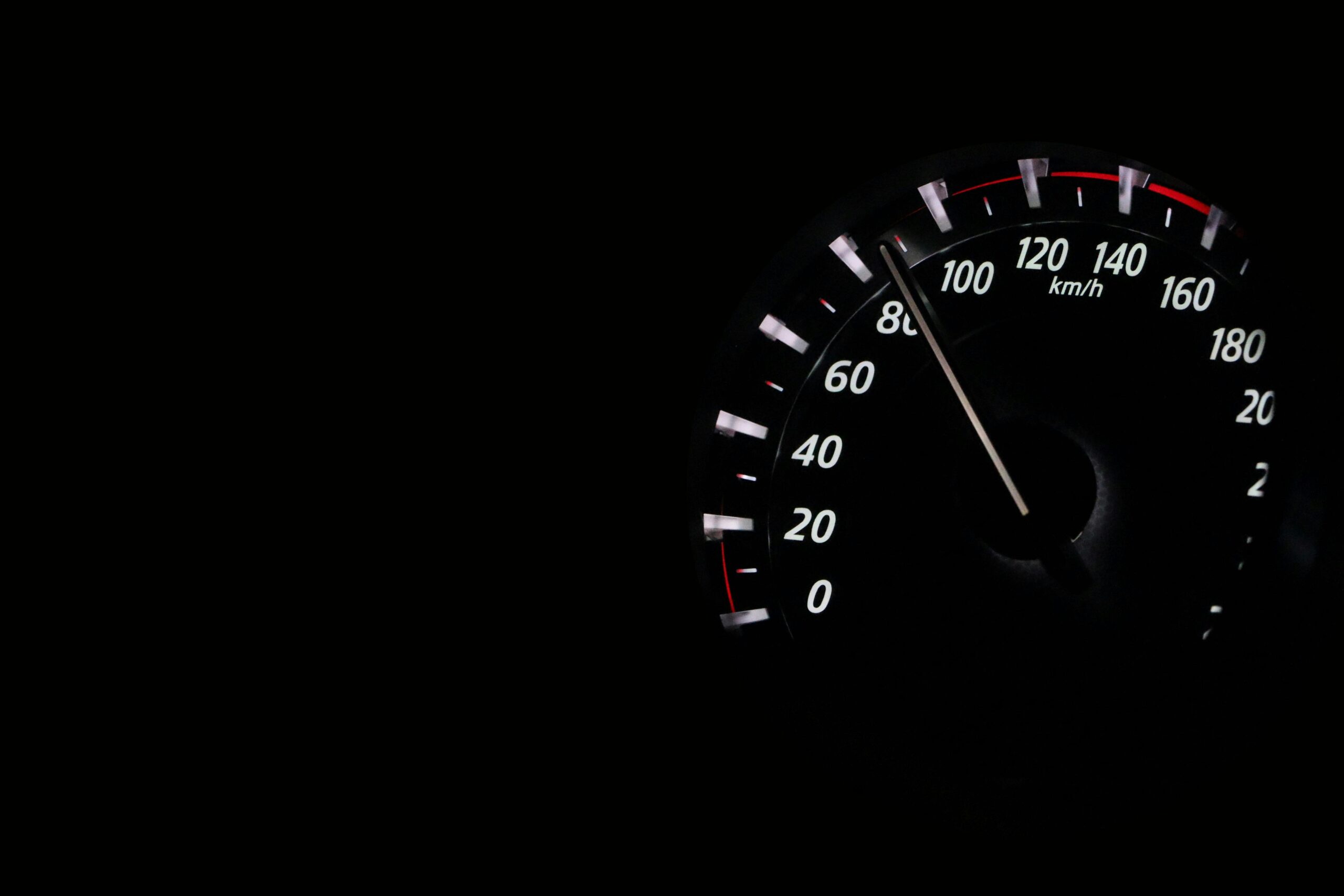 A close-up of a truck speedometer gauge
