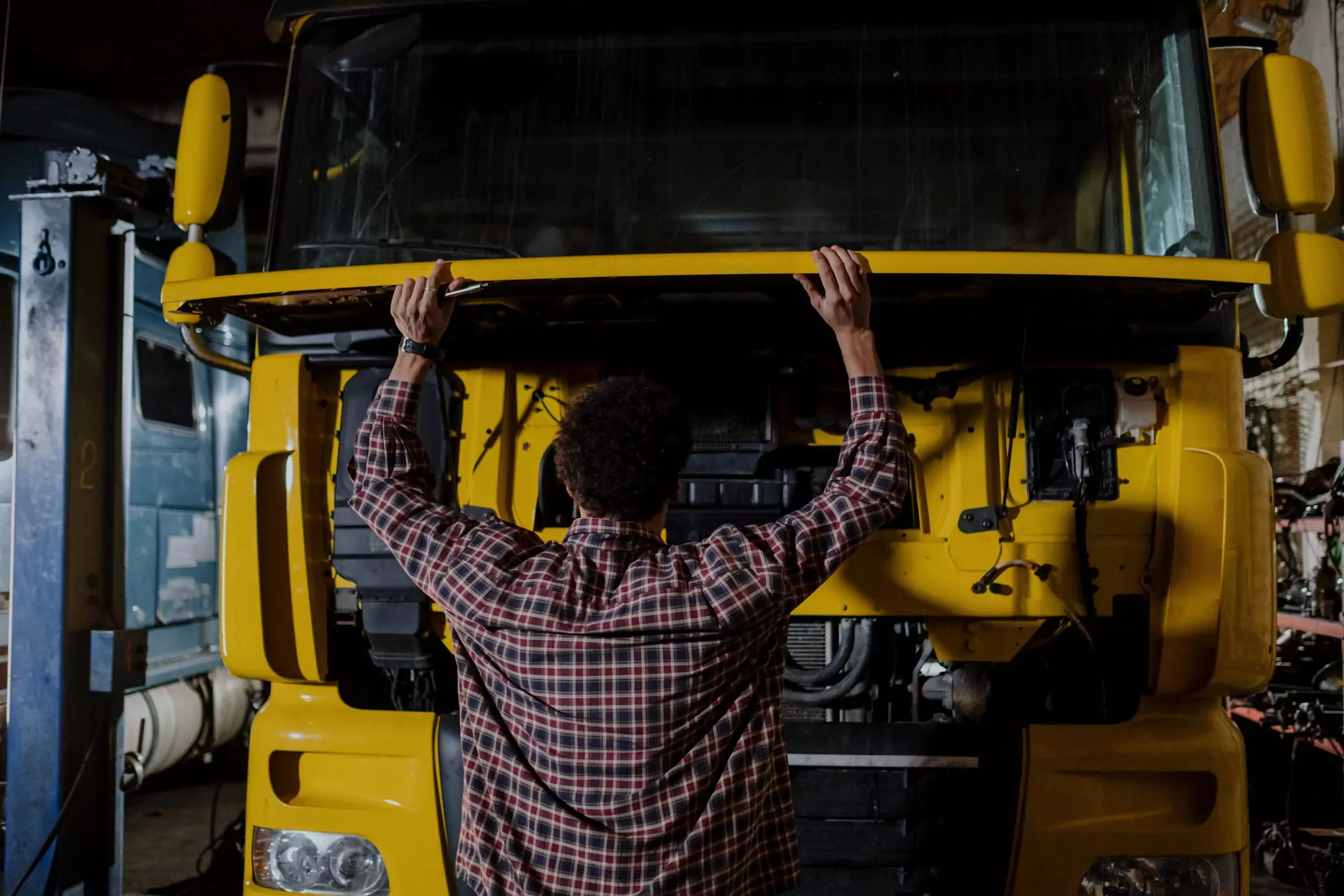 Mechanic checking the engine of his truck